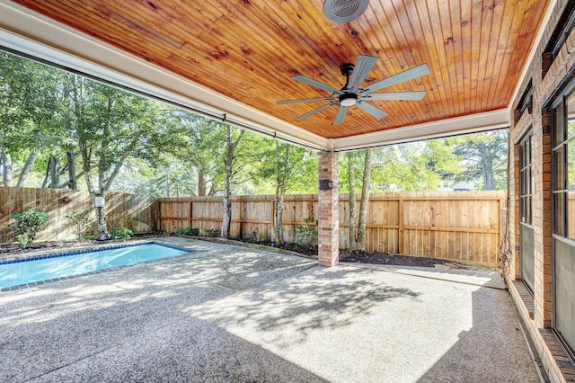 view of pool with ceiling fan and a patio area