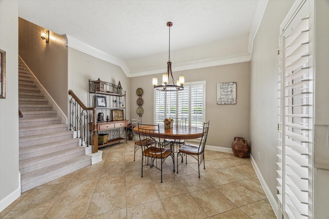 dining area with a chandelier and ornamental molding