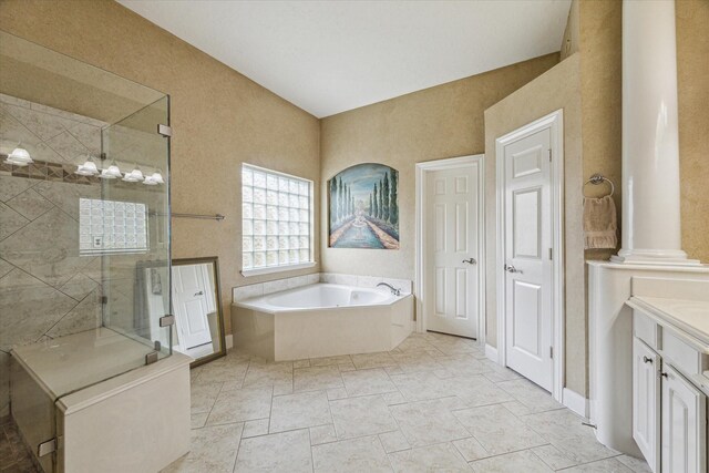 bathroom featuring vanity, decorative columns, and independent shower and bath