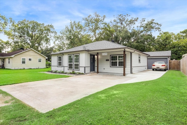 ranch-style house with a front lawn and a garage