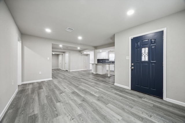 unfurnished living room featuring light hardwood / wood-style flooring