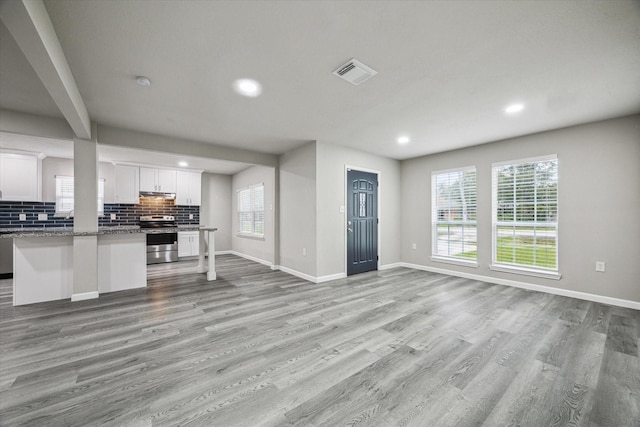 unfurnished living room featuring light wood-type flooring