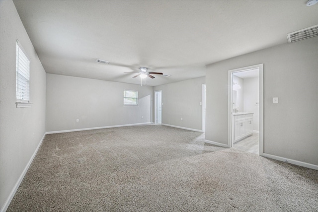 carpeted empty room with ceiling fan