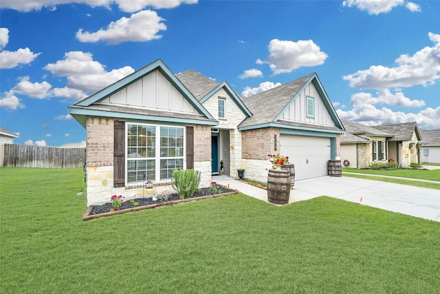 view of front of property with a front yard and a garage