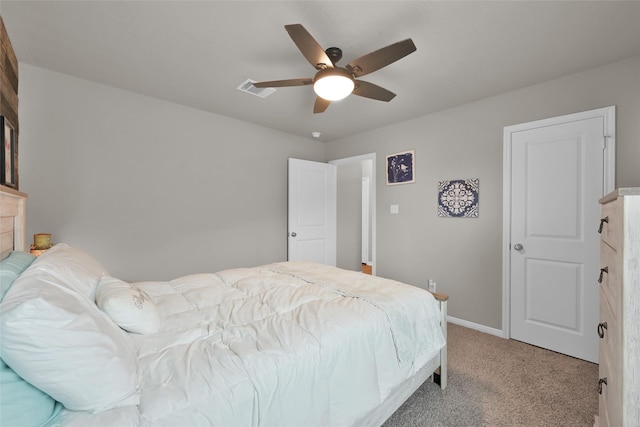 bedroom featuring light colored carpet and ceiling fan