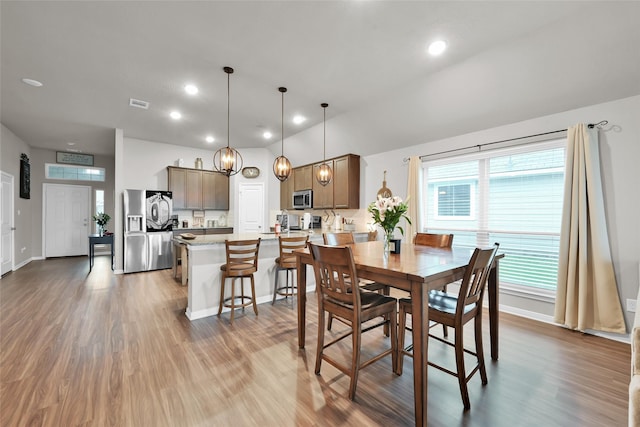 dining room featuring plenty of natural light and dark wood-type flooring