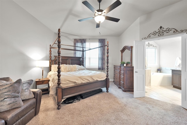 carpeted bedroom with ceiling fan and lofted ceiling