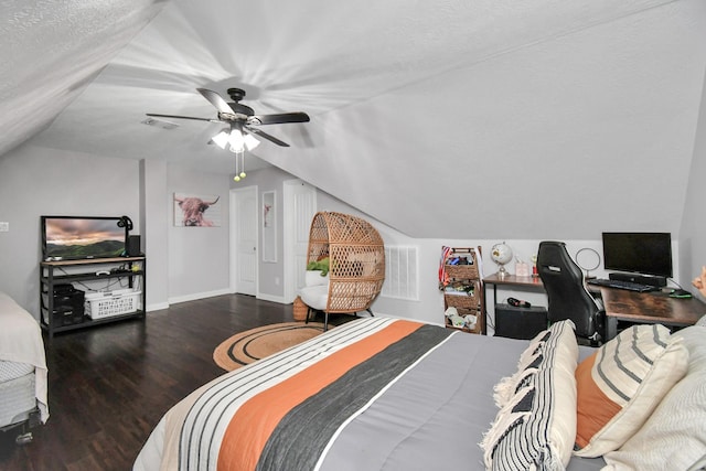 bedroom with a textured ceiling, dark hardwood / wood-style floors, ceiling fan, and lofted ceiling