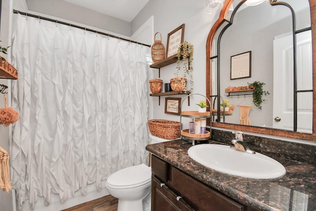 bathroom with hardwood / wood-style floors, vanity, toilet, and a shower with shower curtain