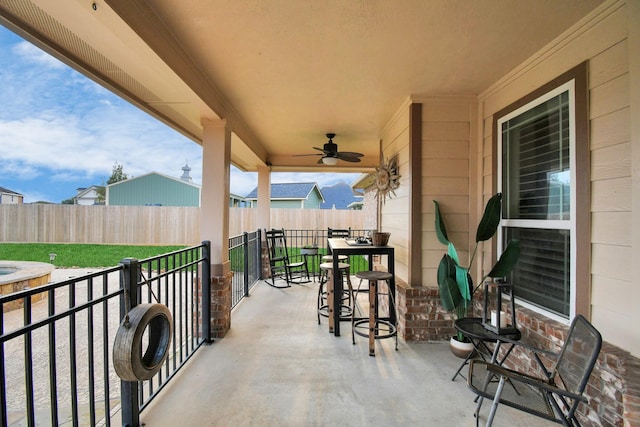 view of patio featuring ceiling fan