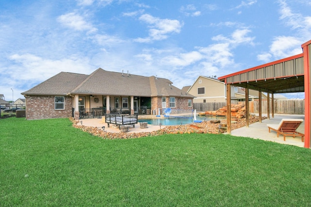 view of yard featuring a patio area and a fenced in pool