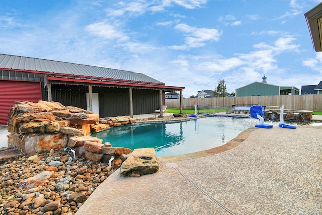 view of swimming pool featuring pool water feature