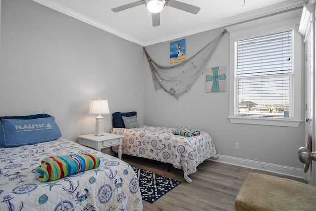 bedroom with ceiling fan, dark wood-type flooring, and ornamental molding