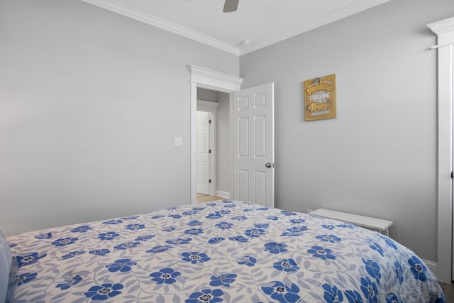 bedroom with ceiling fan and crown molding