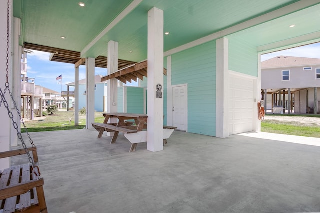 view of patio featuring a garage