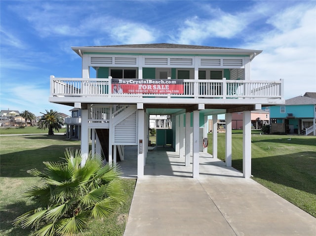 exterior space featuring a carport and a front yard