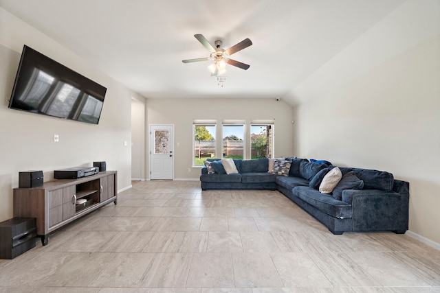 living room with ceiling fan and lofted ceiling