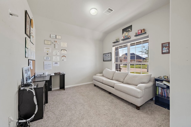 living room featuring light colored carpet and lofted ceiling