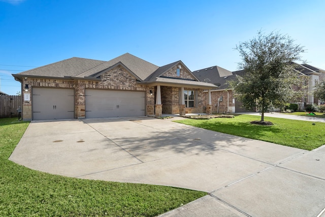 view of front facade featuring a garage and a front lawn