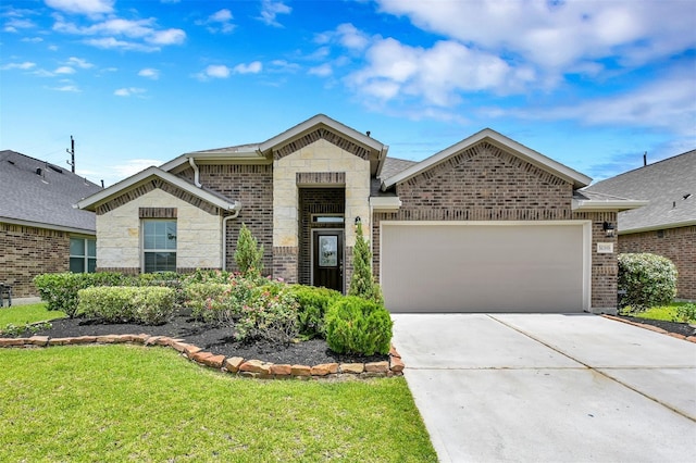 view of front of house featuring a front lawn and a garage