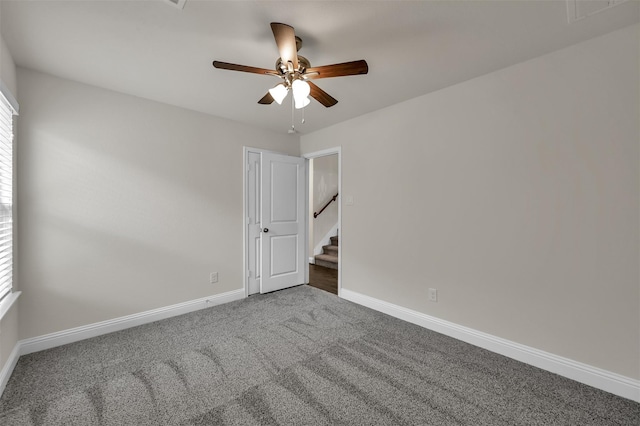 carpeted empty room with ceiling fan