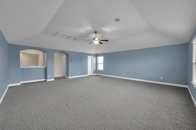 carpeted empty room with ceiling fan and vaulted ceiling