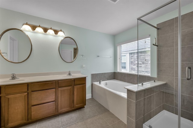 bathroom with tile patterned flooring, vanity, and plus walk in shower