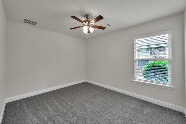 spare room featuring carpet and ceiling fan