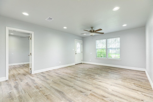 unfurnished room with ceiling fan and light hardwood / wood-style floors