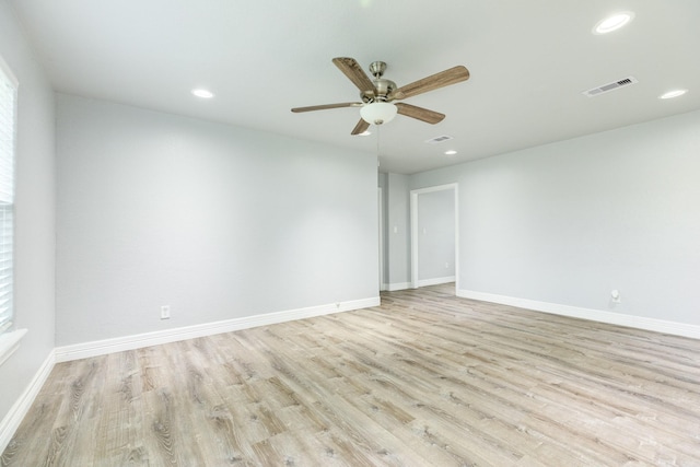 empty room with light hardwood / wood-style flooring