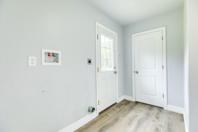 laundry area featuring washer hookup, light hardwood / wood-style flooring, and electric dryer hookup