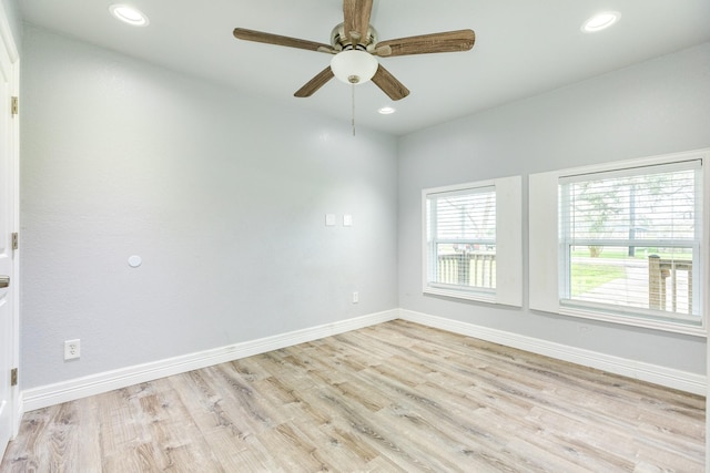 unfurnished room featuring ceiling fan and light wood-type flooring