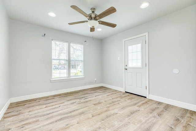 unfurnished room featuring ceiling fan and light hardwood / wood-style floors