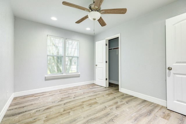 unfurnished bedroom featuring light wood-type flooring, a closet, and ceiling fan