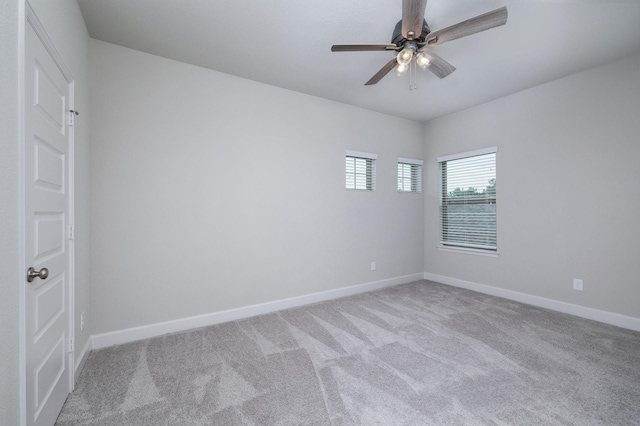 empty room with light carpet and ceiling fan