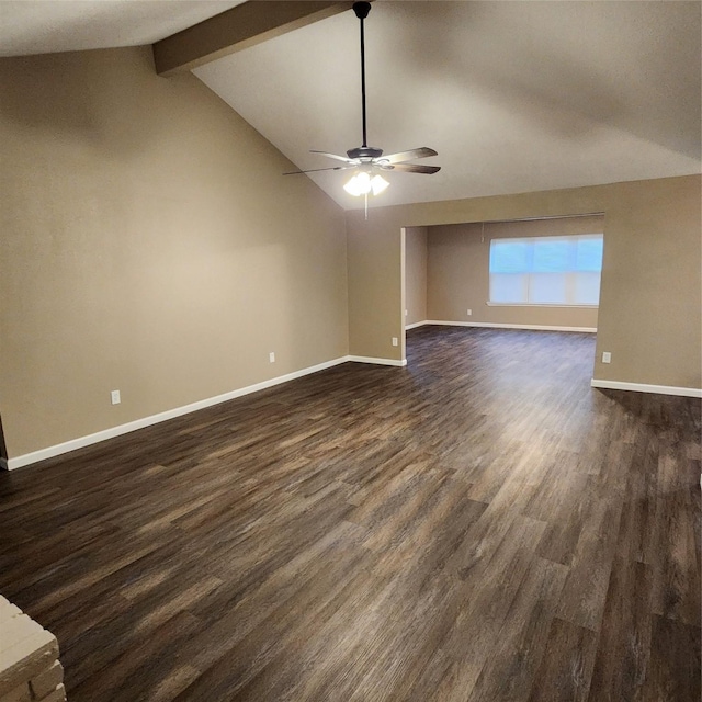 spare room featuring ceiling fan, dark hardwood / wood-style flooring, and vaulted ceiling with beams