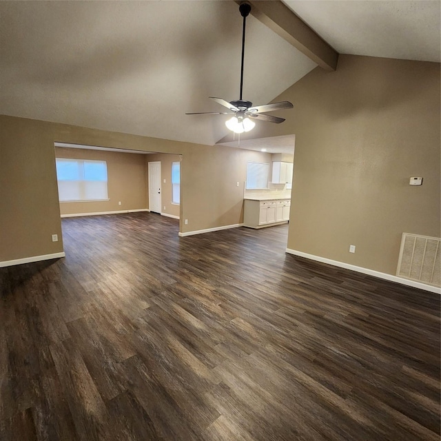 unfurnished living room featuring dark wood-type flooring, ceiling fan, and lofted ceiling with beams