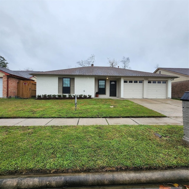 single story home with a front lawn and a garage