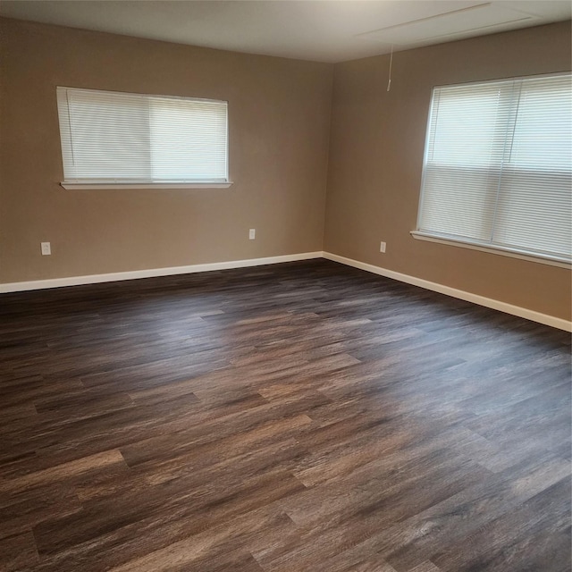 empty room featuring dark wood-type flooring