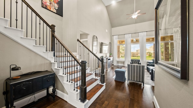 entrance foyer featuring high vaulted ceiling, dark hardwood / wood-style floors, and ceiling fan