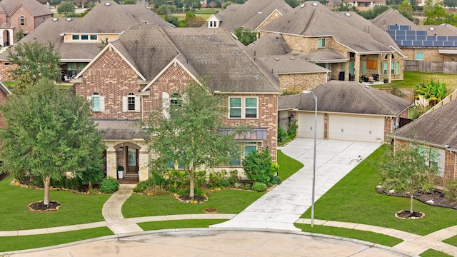 view of front facade featuring a garage and a front lawn