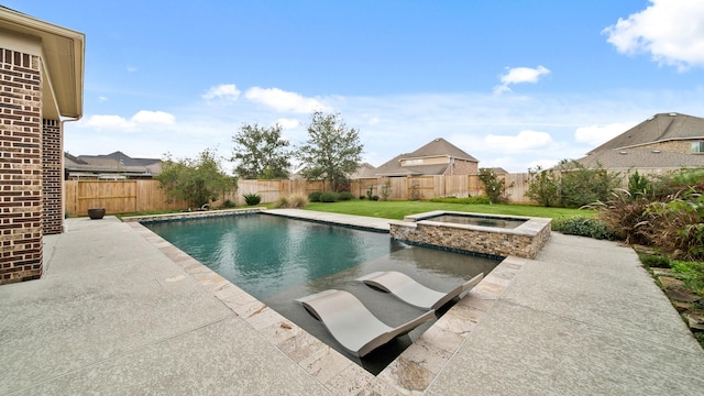 view of pool featuring an in ground hot tub, a yard, and a patio area