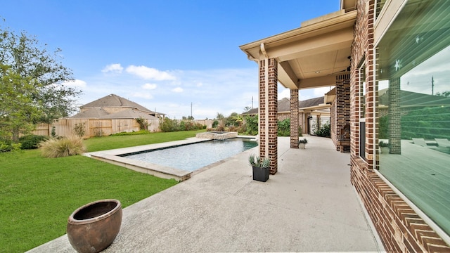 view of pool with a yard and a patio