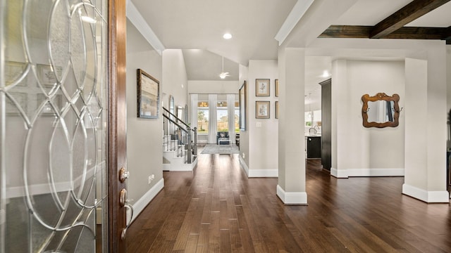 foyer entrance featuring french doors, dark hardwood / wood-style floors, sink, and beam ceiling