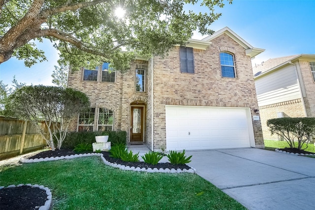 view of front of property with a front yard and a garage