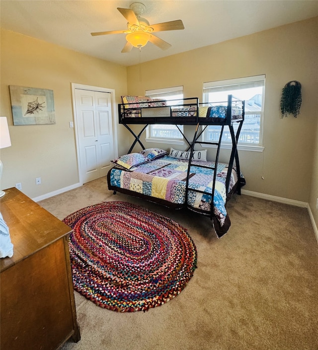 bedroom with carpet flooring, a closet, and ceiling fan