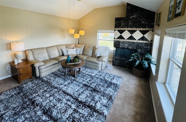 carpeted living room with lofted ceiling and a premium fireplace