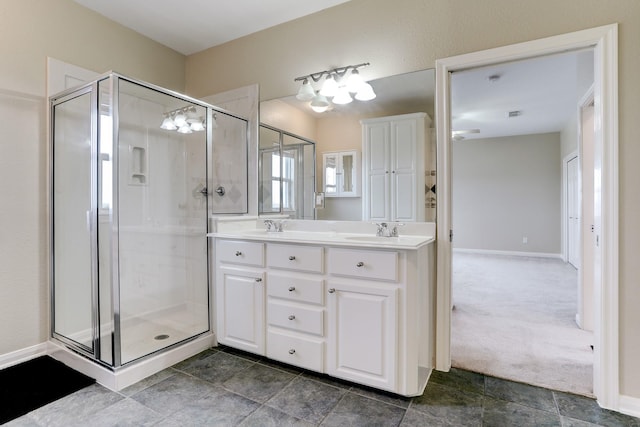 bathroom featuring vanity and an enclosed shower