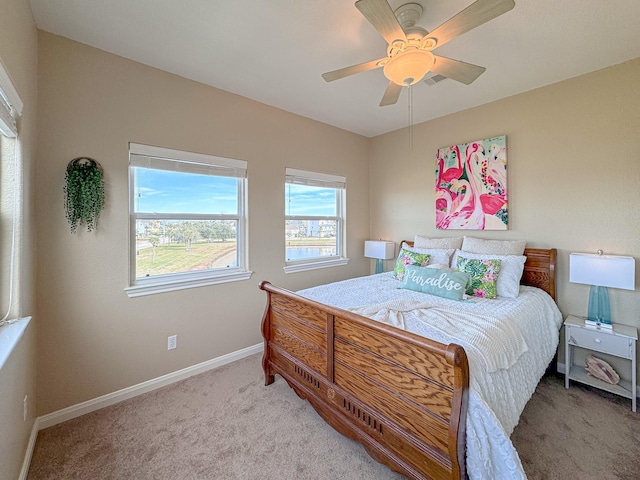 bedroom with ceiling fan and carpet floors