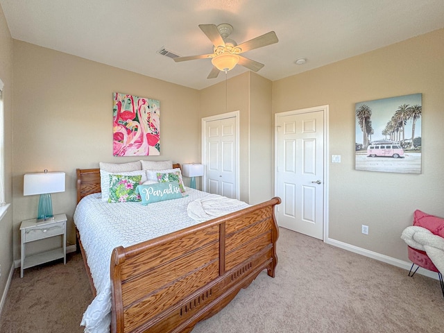 bedroom featuring ceiling fan, a closet, and carpet floors